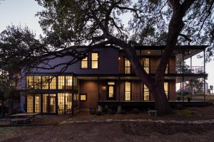 This 400-year-old tree in Austin, Texas inspired the landowners to incorporate it into the design of their southern-inspired home, rather than cut it down. 