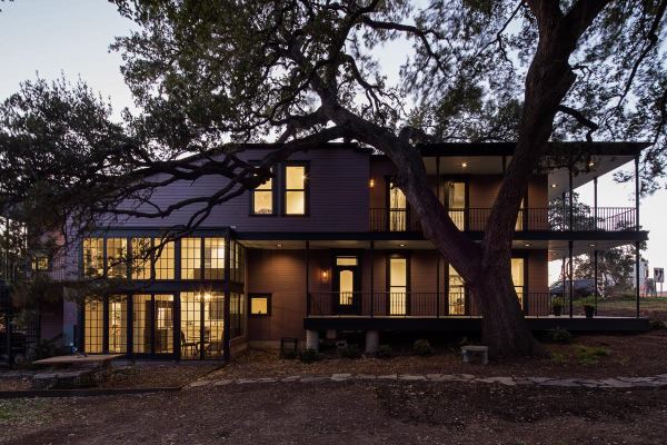 This 400-year-old tree in Austin, Texas inspired the landowners to incorporate it into the design of their southern-inspired home, rather than cut it down. 