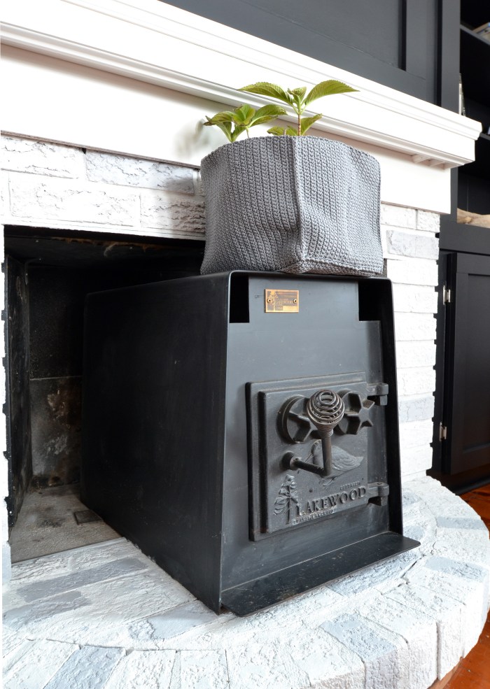 whitewash on red brick fireplace